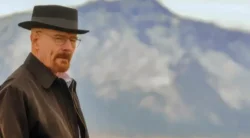 Heisenberg standing in front of a scenic mountain view